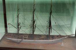 A cased hand built scale waterline model of a three masted sailing vessel. Fully rigged. Case 45 x