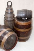 Two oak and copper bound spirit barrels.