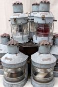 A rare early 20th Century set of seven ships lanterns of Galvanised and brass construction with