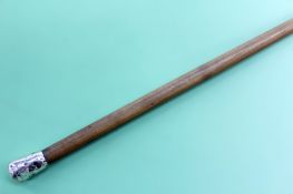 A lady’s rhinoceros horn walking cane with silver coloured handle. Dated 1884 57cm long and