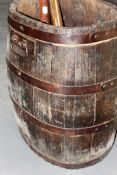 A coopered oak an iron bound oval barrel.