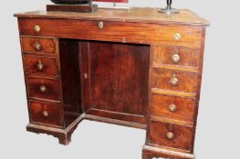 An unusual mahogany 19th Century pedestal desk. Hinged top section above central cupboard. Flanked