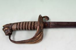 A 19th Century naval officers dress sword. Shark skin grip, lion pommel. Etched blade. 87cm long.