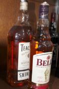 Bottle of Teacher’s Whiskey and a bottle of Bell’s whiskey.