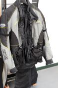 A Shoei motorcycle jacket and over trousers in near new condition together with a set of body