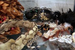 A varied collection of South Seas jewellery and feather accessories. Including shell ornaments, a