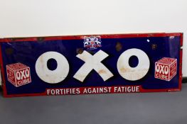 An enamel advertising sign. “Oxo - Fortifies against fatigue”. 183 x 61cm.