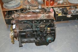 A Triumph 2500 engine. A Triumph dashboard and a large collection of miscellaneous parts and