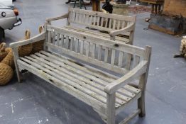 A pair of teak garden benches constructed from the timbers of HMS POWERFUL