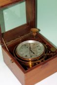 A Thomas Mercer Ltd marine chronometer. Serial no 19446 - gimble mounted in mahogany case with