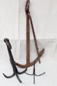 A large 19th Century wrought iron ships anchor.