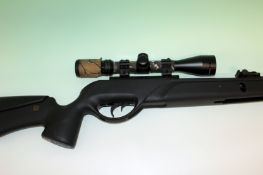 An El Gamo Socom 0.22 air rifle with hawke telescopic sight and padded gun case.