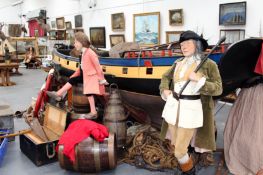 Two life size museum mannequins. In 18th century dress.