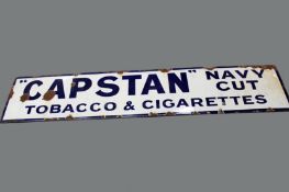 An enamel advertising sign. “Capstan Navy Cut Tobacco & Cigarettes. 182 x 38cm.