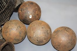 A group of four Victorian iron cannon balls. 14cm diameter, 32lb.
