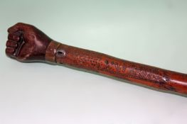 An interesting 19th Century South Seas walking cane with carved hardwood fist pommel and chip carved