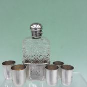 A Victorian silver mounted cut glass spirit flask with detachable base. London 1891. 14cm high.