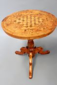 A 19th Century Italian parquetry inlaid tilt top games table. Circular top, baluster pedestal with