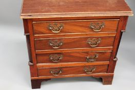 A 19th Century miniature chest of four mahogany drawers. On bracket feet. 51cm wide.