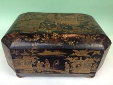 A Chinese export lacquer tea caddy. Gilt decoration of figures and pavilions. Interior fitted with