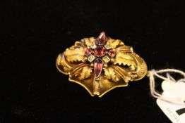 A Victorian gold pendant with amethyst paste set centre.