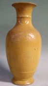 A Chinese yellow ground baluster vase with incised decoration. 22cm high.