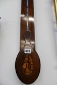 A 19th Century mahogany stick barometer. Unsigned silver dial with thermometer. Period crest to case