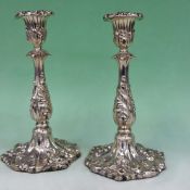 A pair of early Victorian silver candlesticks with sconces. The columns with acanthus designs.