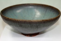 A Chinese Sung type pottery shallow bowl. 19cm diameter x 8cm high.