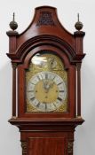 A 19th Century mahogany cased longcase clock. Pagoda top with pierced panels. brass arched dial with