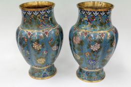 A pair of Chinese cloisonne lobed vases with butterfly and chrysanthemum designs. 26cm high.