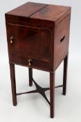 A George III mahogany night stand with twin rising tops over cupboard and drawer. Platform stretcher