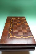 An antique inlaid folding games board. Inlaid with various specimen woods.