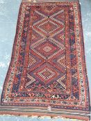 An antique Persian Afshar rug, 205 x 113cm.