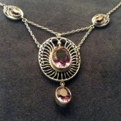 An Art Nouveau pierced silver and amethyst necklace. Bears mark of Murrle Bennett & Co.