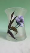 A Loetz style glass beaker vase. With enamelled poppy and dragonfly decorations. 12cm high.