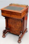 An early Victorian and later walnut Davenport desk. Brass gallery back and leather inset top