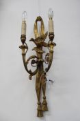 A pair of antique carved giltwood Georgian style twin light wall sconces. Tasseled swags with scroll