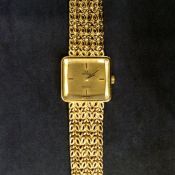 A Ladies Omega De Ville 18ct gold bracelet watch. Total weight 65grams.