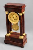 A 19th Century Portico clock. Flame mahogany case with ormolu mounts and dial. Two train bell strike