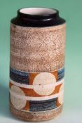 A Troika cylindrical vase. with geometric designs SK. 20cm high. 10cm diameter.
