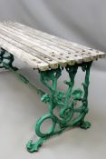 A Coalbrookdale pattern cast iron wooden slatted garden table. Unmarked. 160cm. 55cm deep. 65cm