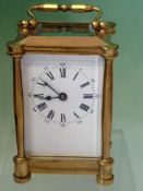 A late 19th Century French carriage timepiece. With white enamel dial. 11cm high.