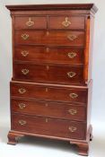 A late Georgian mahogany tall boy chest on chest. Green upholstery and moulded cornice over two