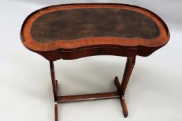 A French Directoire walnut ladies work/writing table. Galleried kidney shape top with apron