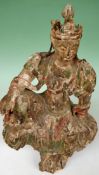 A Chinese carved wood seated figure of Guanyin. Retaining some polychrome decoration. 56cm high.