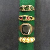 A Victorian 15ct gold gem set ring, an Edwardian pearl five stone ring and two others (4).