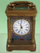 A miniature brass carriage clock with enamelled dial and sides. Elliott & Sons London. 8.5cm high.