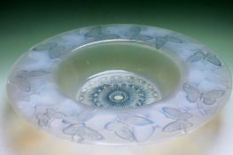 A Lalique glass wide rimmed opalescent bowl ‘Phalenes’. 39cm diameter.