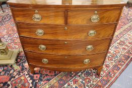 A late Regency mahogany bowfront chest. Two short drawers over three long graduated drawers.